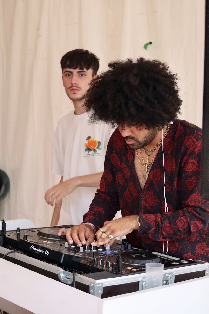 men with dj mixer