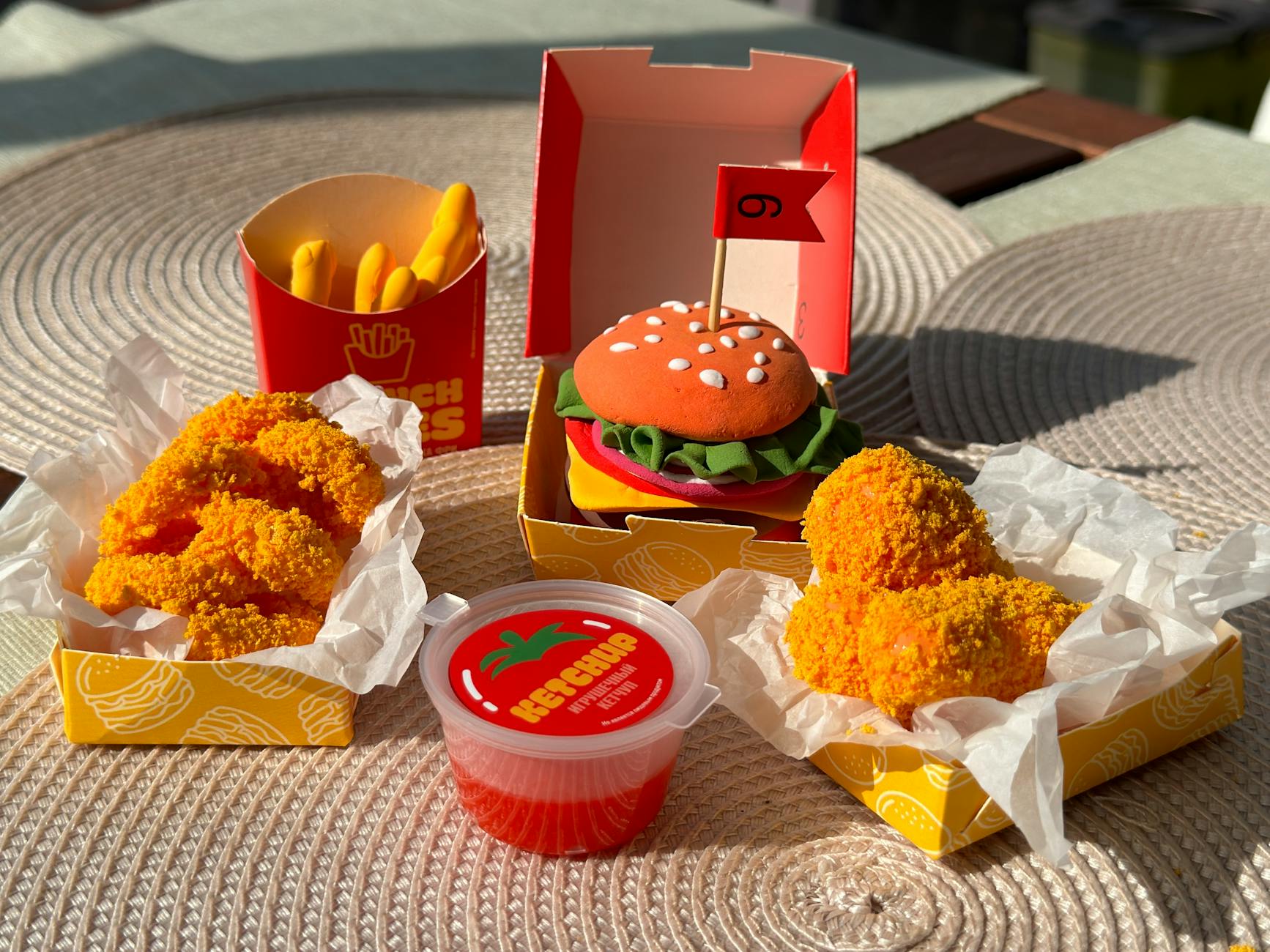 colorful play food set with burger and fries